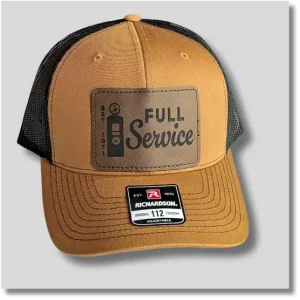 Caramel Full Service baseball cap featuring a dark rectangular leather patch with retro automotive lettering