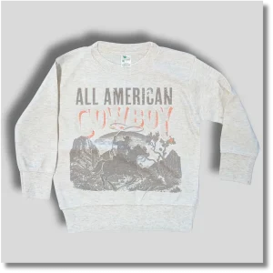 Light gray All American Cowboy youth long sleeve T-shirt featuring vintage western-themed graphic lettering