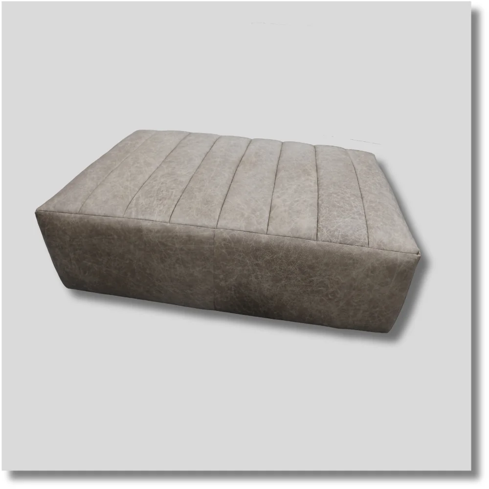Highball oversized square leather ottoman with neutral gray upholstery and tufted cushion design